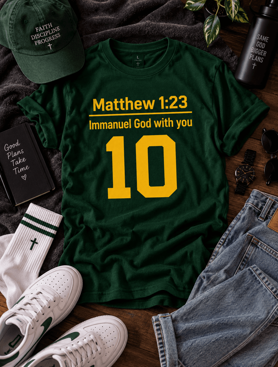 Flatlay of a green Matthew 1:23 Immanuel God With You 10 t-shirt with a Faith Discipline Progress cap